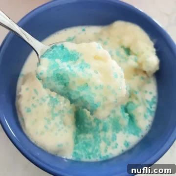 Snow ice cream with blue sprinkles in a blue bowl
