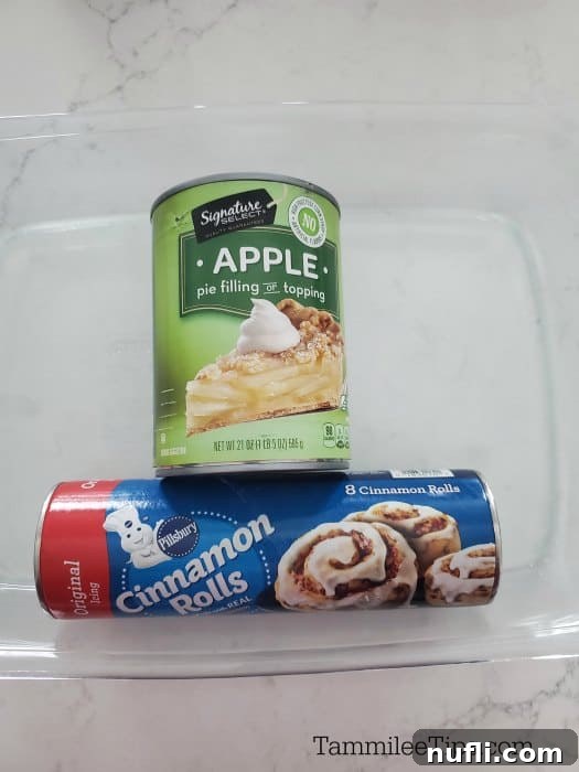 Cinnamon Roll Apple Pie Bake 3 Apple Pie Filling can and cinnamon roll container in a glass baking dish