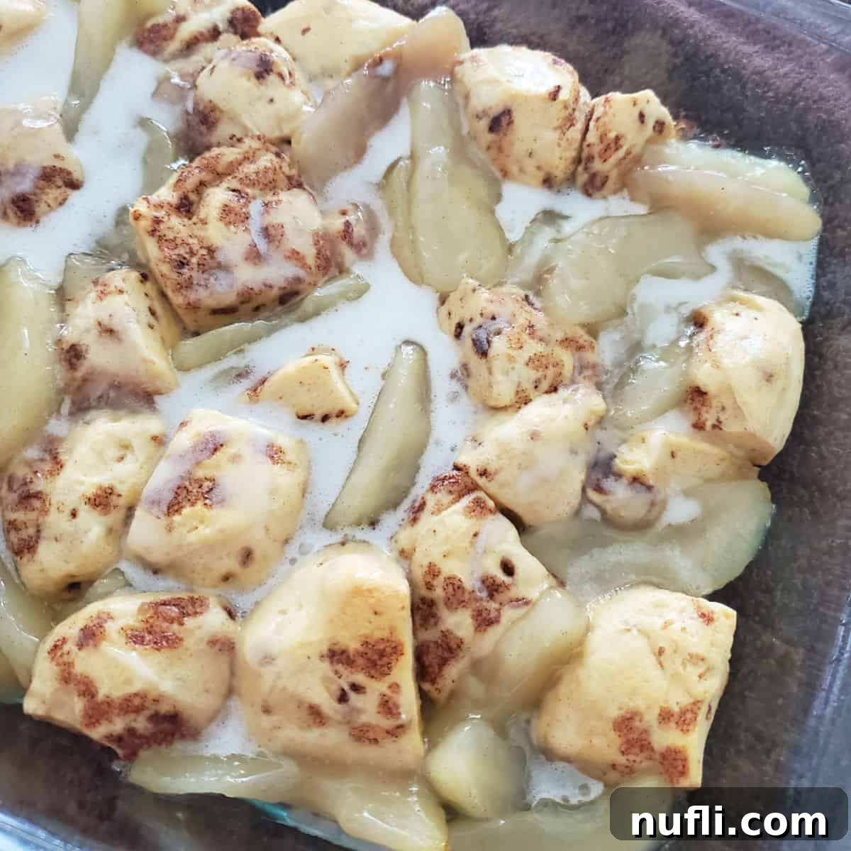 Cinnamon Roll Apple Pie Bake 7 2-Ingredient Cinnamon Roll Apple Cobbler in a glass baking dish