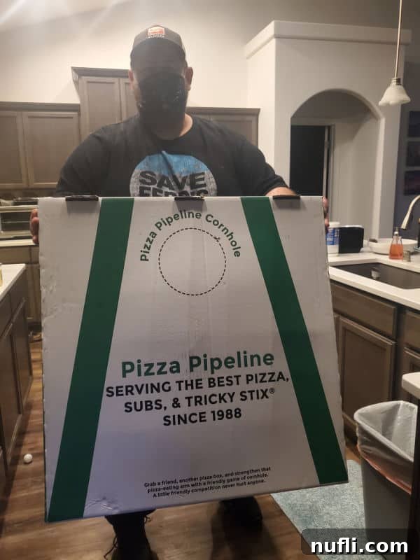 Spokane's Top Pizza Spots 14 John holding a giant pizza pipeline box