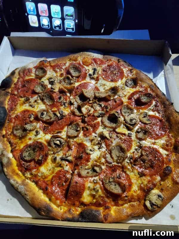 Spokane's Top Pizza Spots 28 pepperoni, and sausage pizza in a cardboard delivery box