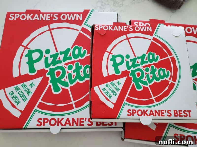 Spokane's Top Pizza Spots 29 Three Pizza Rita boxes on a white counter