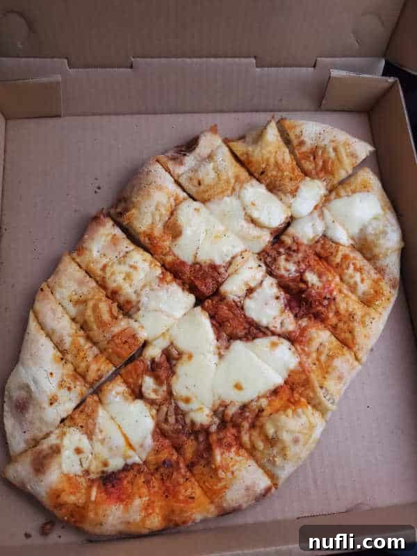 Spokane's Top Pizza Spots 8 Cheese bread in a cardboard delivery box