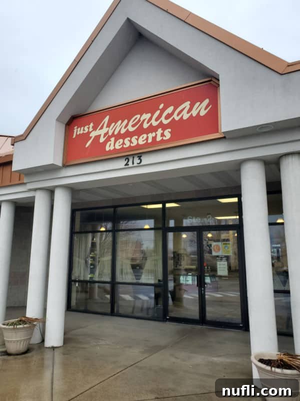 Spokane's Top Bakeries: Your Sweetest Guide 13 Just American Desserts sign over the front entrance to the bakery
