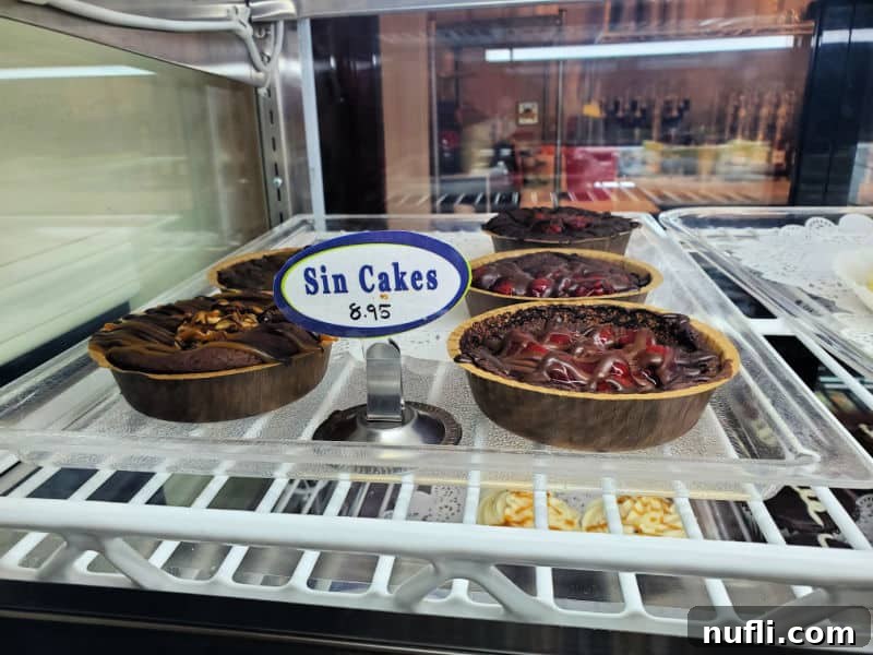 Spokane's Top Bakeries: Your Sweetest Guide 18 sin cakes on a platter in a dessert case