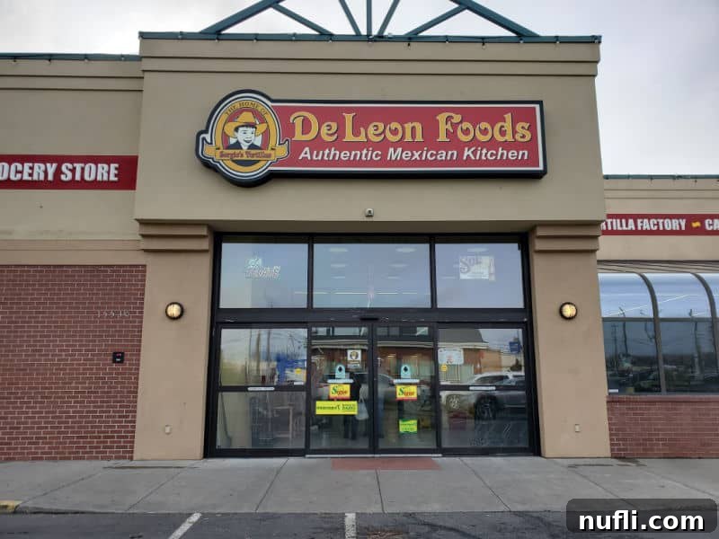 Spokane's Top Bakeries: Your Sweetest Guide 22 De Leon Foods sign over a glass entrance door to a grocery story
