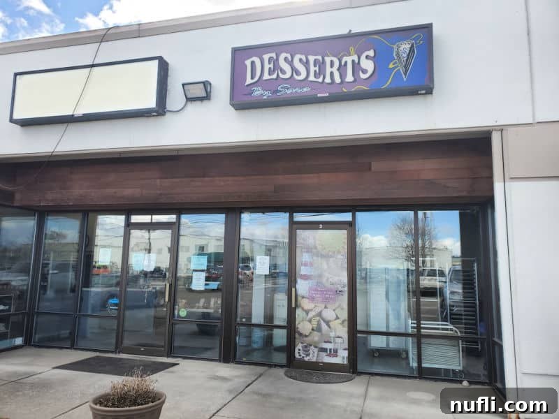 Spokane's Top Bakeries: Your Sweetest Guide 26 Desserts by sara sign over a glass door entrance to the bakery