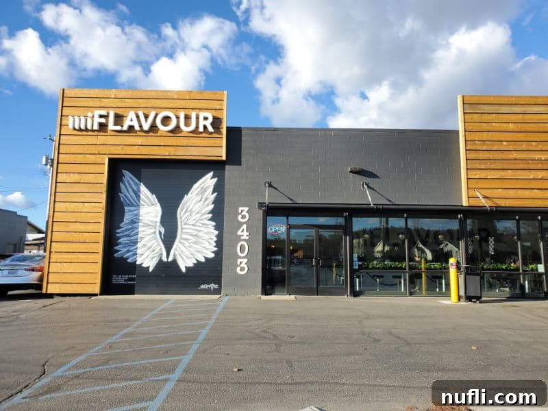 Spokane's Top Bakeries: Your Sweetest Guide 5 miFlavour sign over angel wings on a brick building with glass entrance doors