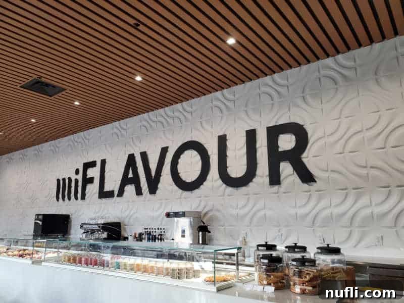 Spokane's Top Bakeries: Your Sweetest Guide 6 miFlavour sign on the wall of the bakery with a case filled with macarons