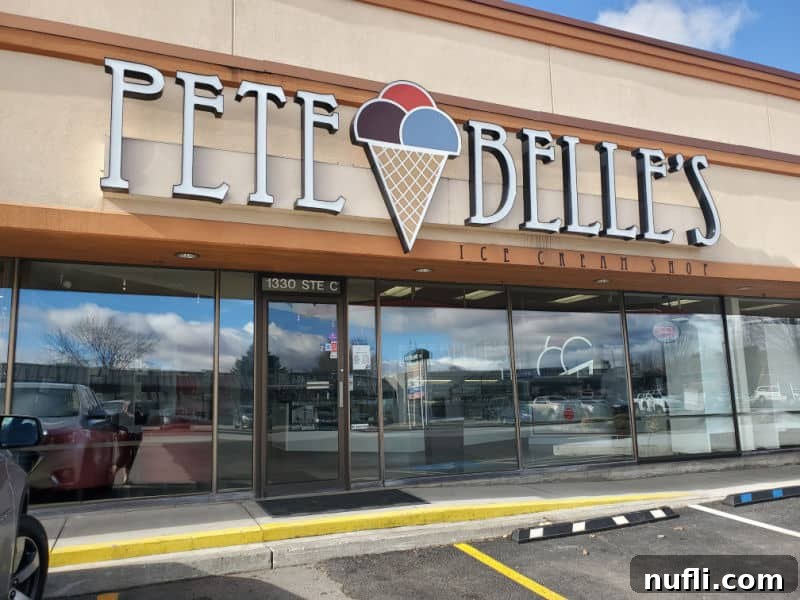 Pete & Belles sign above glass windows and the entrance to the ice cream shop