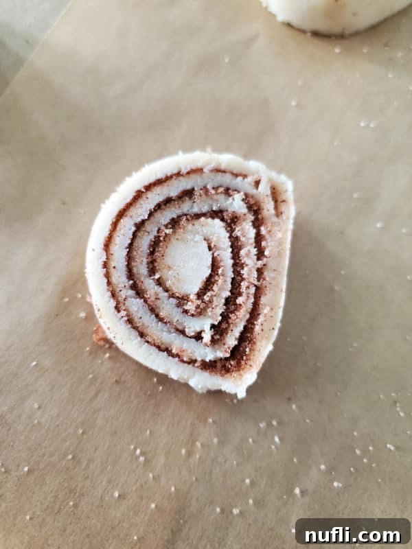 A close-up shot of raw pie crust dough, freshly rolled out and ready for toppings and shaping.
