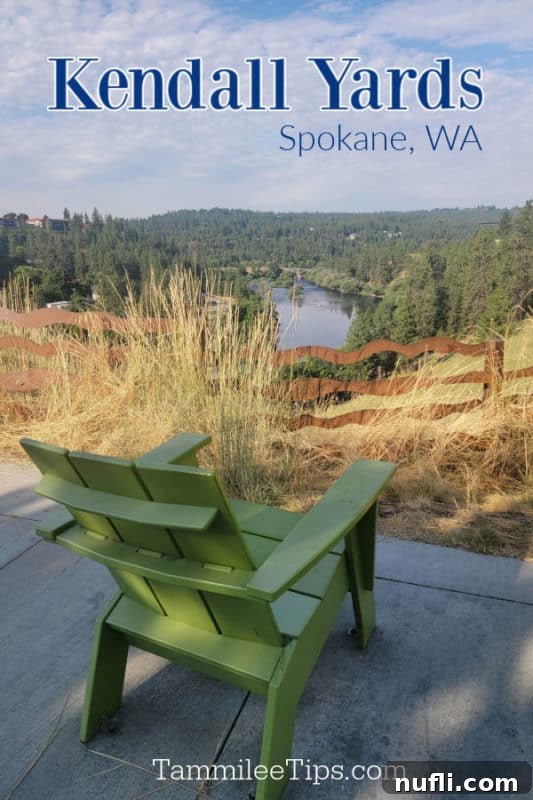 Kendall Yards Spokane WA over a green Adirondack chair overlooking the spokane river. 