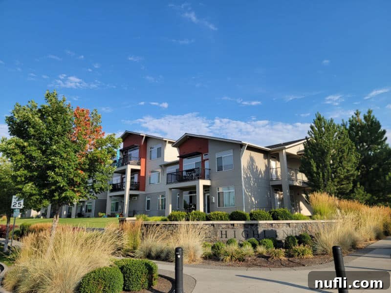 Residential condos near trees with a Highline sign in Kendall Yards