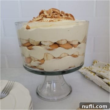 Magnolia Bakery Banana Pudding layered in a large trifle dish with crushed wafers.