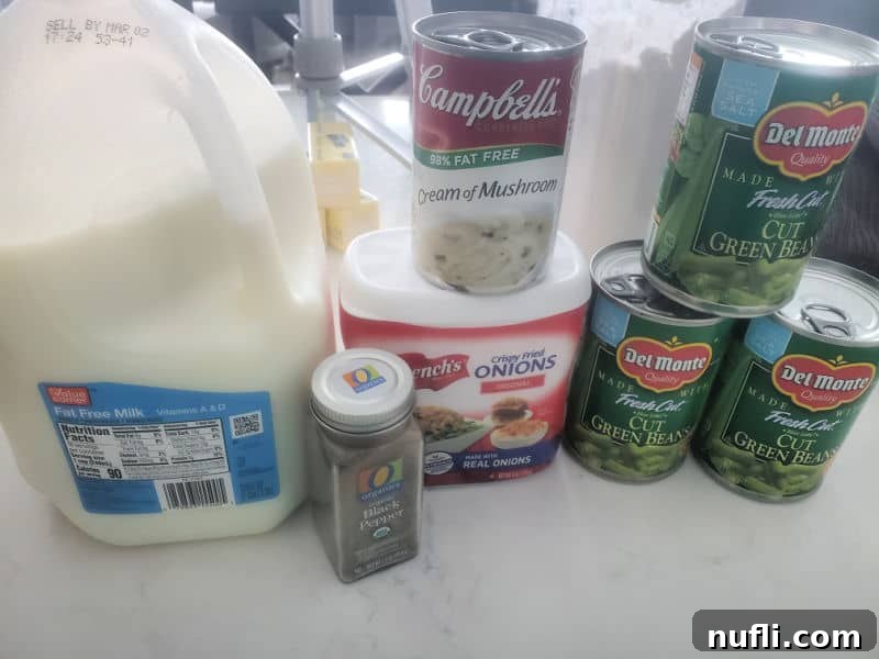 Ingredients for Campbell's Green Bean Casserole: milk, pepper, crispy fried onions, cream of mushroom soup, and cut green beans
