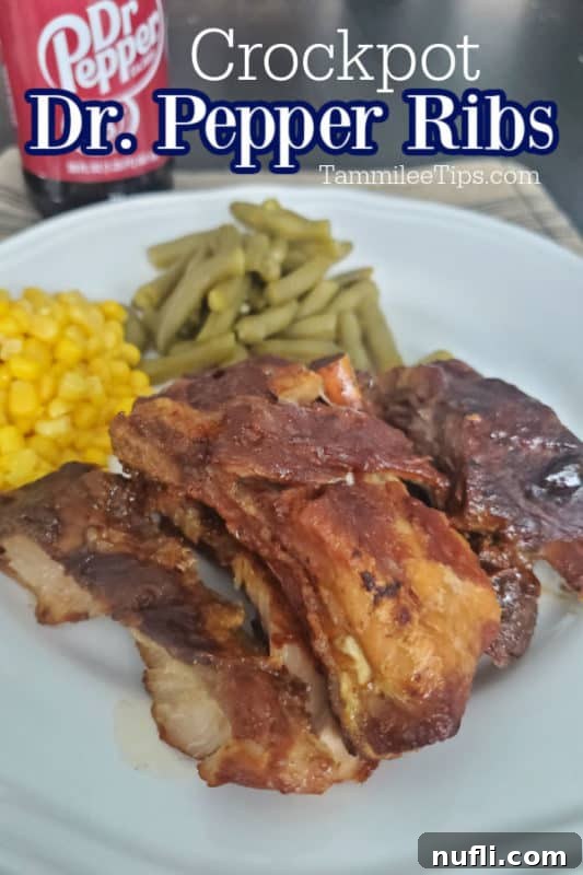 A serving of Dr. Pepper Crock Pot Ribs on a white plate, accompanied by vibrant green beans and sweet corn. A can of Dr. Pepper sits blurred in the background, hinting at the key ingredient.