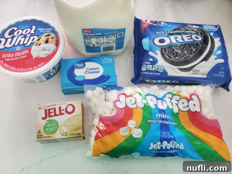 Oreo Fluff Ingredients, cool whip, milk, Oreo Cookies, Cream Cheese, Jello, and Mini Marshmallows