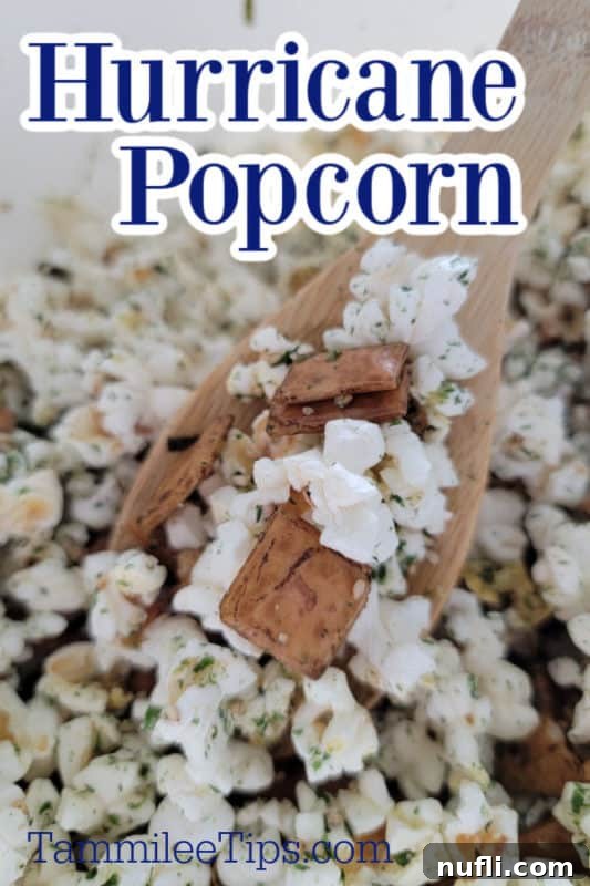 Hurricane Popcorn over a wooden spoon holding popcorn mix