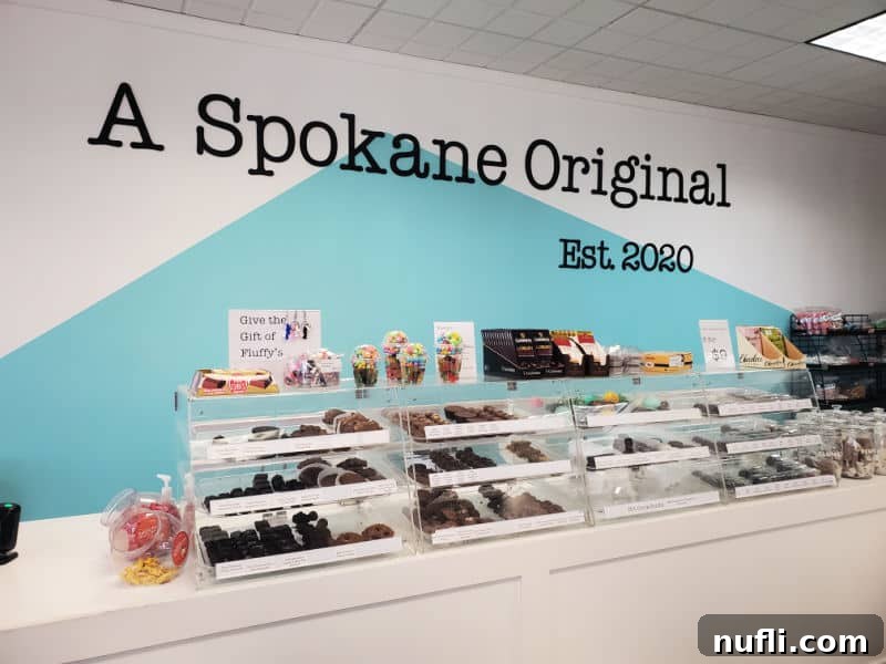 A Spokane original est 2020 on the back wall above candy displays