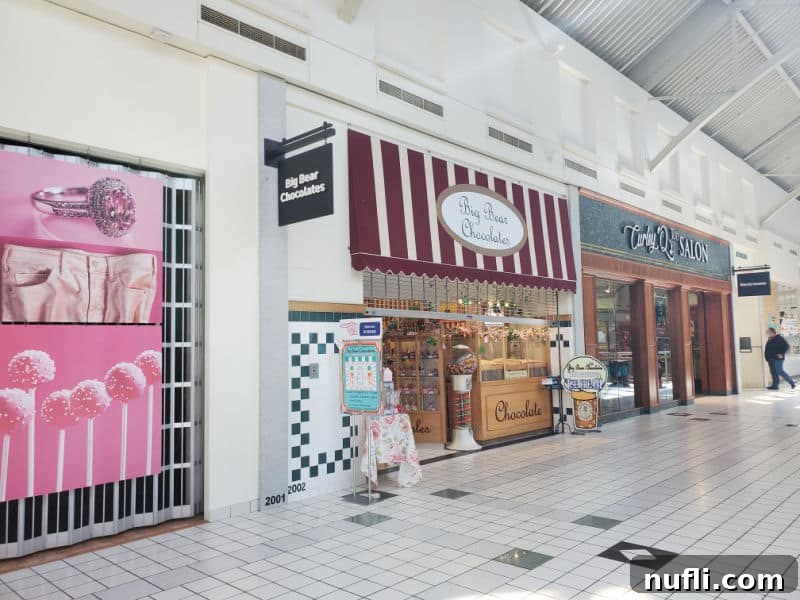 Big bear chocolate sign over a candy shop in the mall