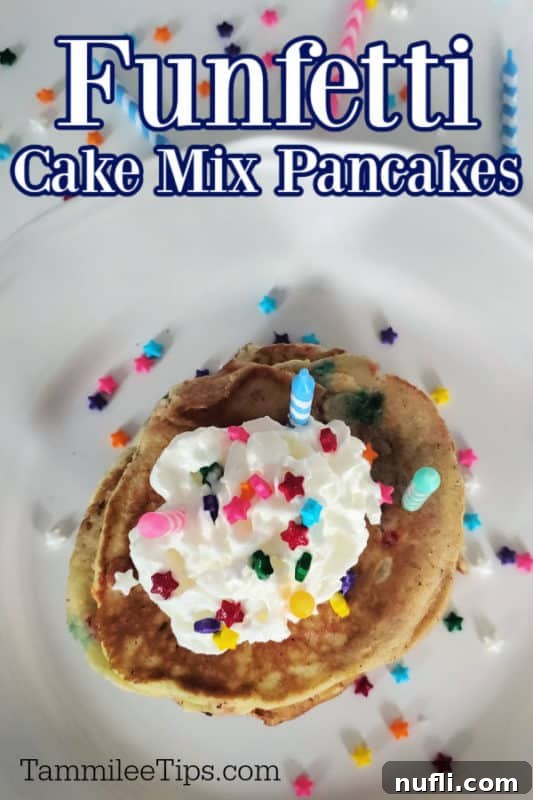 A stack of vibrant Funfetti Cake Mix Pancakes, generously topped with fluffy whipped cream, colorful sprinkles, and a single lit birthday candle, ready for a celebration.