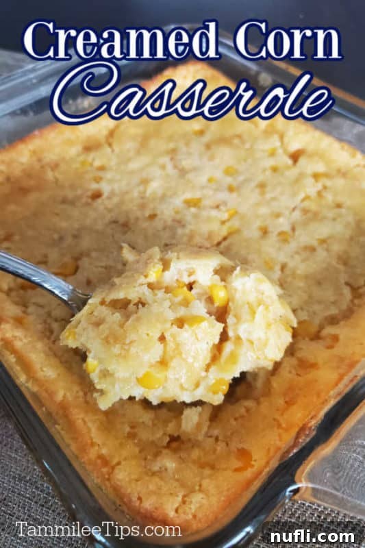 A spoon dishing out creamy corn casserole from a baking pan, with 'Creamed Corn Casserole' text overlay.
