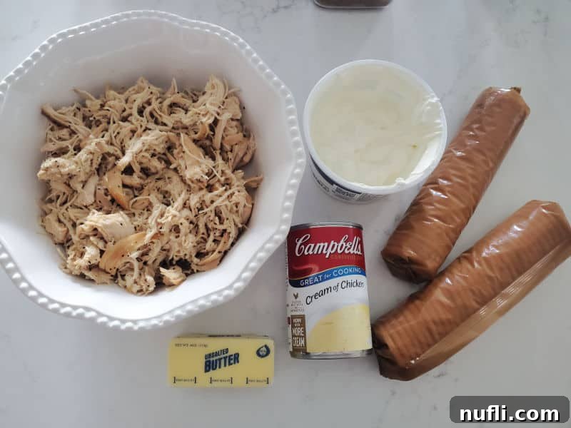 Golden Ritz Topped Chicken Casserole 3 Shredded chicken in a white bowl, sour cream, ritz crackers, butter, cream of chicken soup