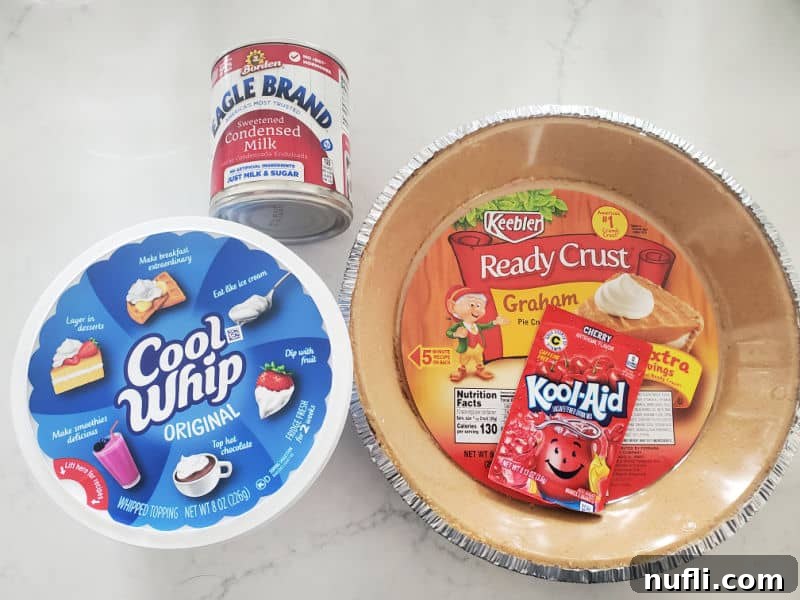 Kool Aid Pie ingredients cool whip, sweetened condensed milk, graham cracker crust, and kool aid packet
