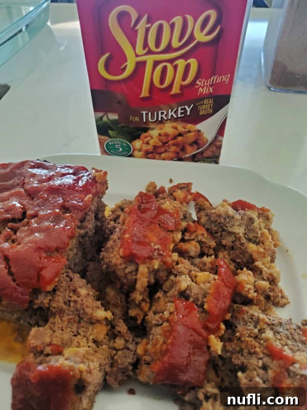 Stove Top stuffing box next to a white plate with slices of Stove Stop Stuffing. 
