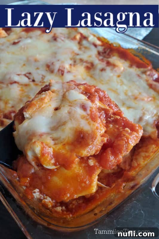 Lazy Lasagna over a glass casserole dish with a spoon scooping out lasagna, showing melted cheese and rich sauce.