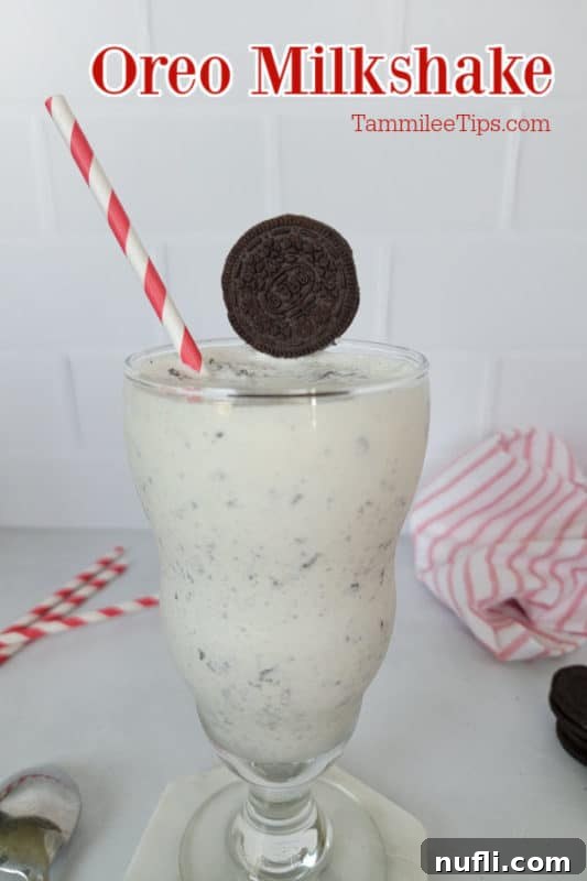 Whip Up a Perfect Oreo Milkshake 2 Delicious Oreo Milkshake in a glass, garnished with an Oreo cookie and served with a red striped straw.