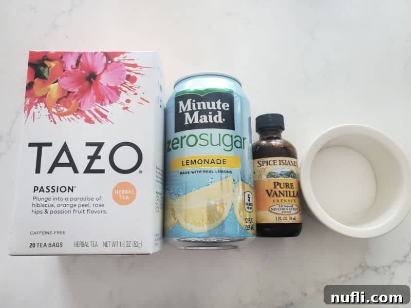 Recreate Starbucks Passion Tea Lemonade 3 Tazo Passion Tea box, Minute Maid Zero Sugar, pure vanilla, and sugar on a white counter