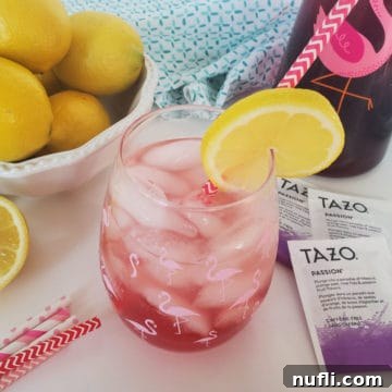 Recreate Starbucks Passion Tea Lemonade 8 Copycat Starbucks Passion Tea Lemonade in a mason jar next to Tazo Passion tea bags, and a bowl of lemons