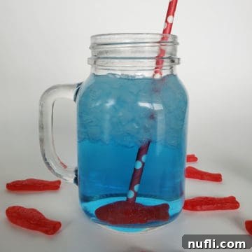 Homemade Sonic Ocean Water Drink Guide 10 Sonic ocean water in a mason jar with a Swedish fish candy and red straw