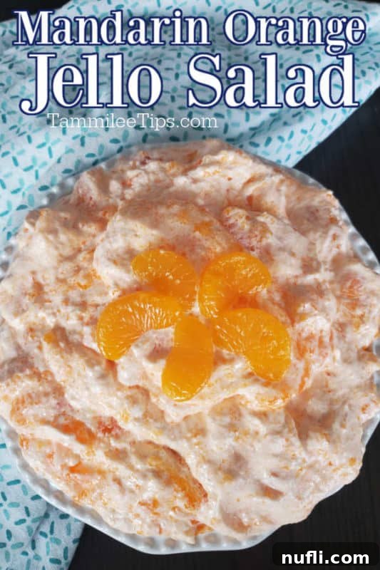 Mandarin Orange Jello Salad over a bowl filled with jellow salad