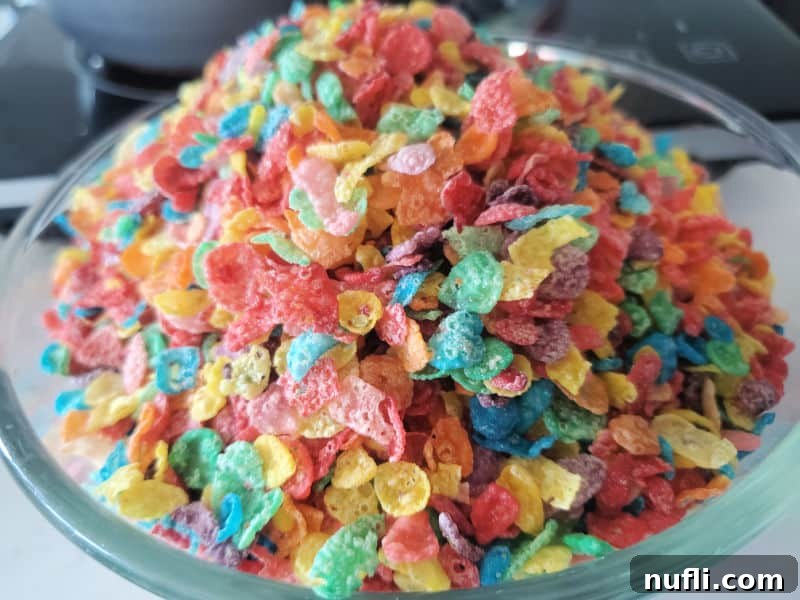Vibrant Fruity Pebbles Rice Krispie Treats 4 Fruity pebbles cereal in a glass bowl