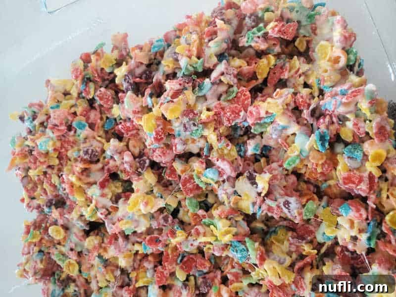 Vibrant Fruity Pebbles Rice Krispie Treats 5 Fruity Pebbles Rice Crispy treats in a glass baking dish