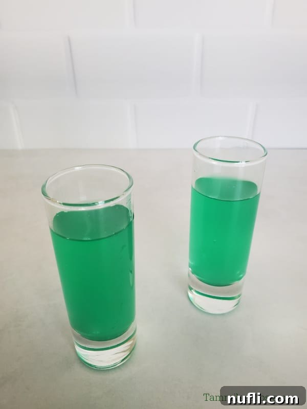 two green liquid marijuana shots