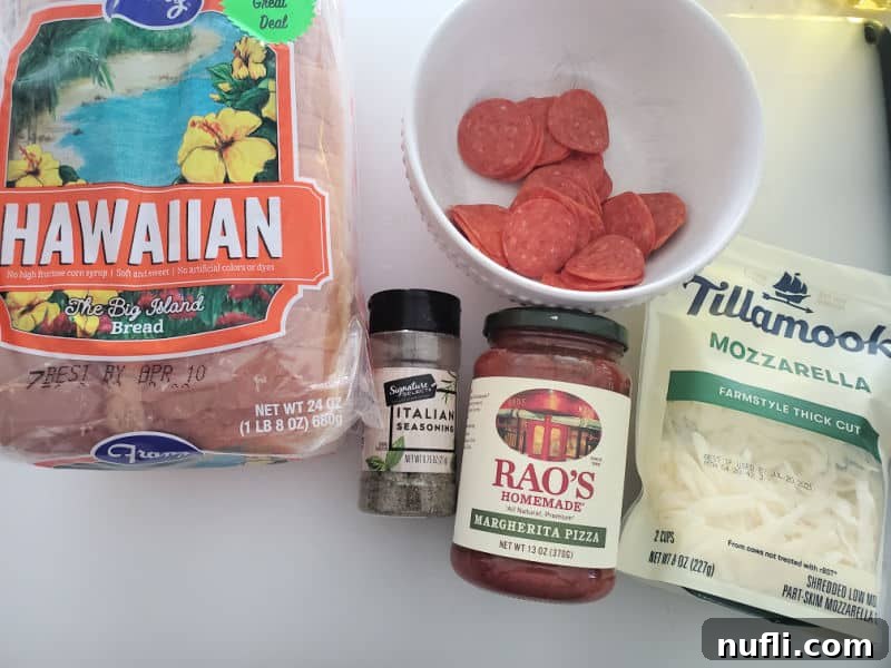 Hawaiian bread, pepperoni in a white bowl, Italian seasoning, Rao's margherita pizza sauce, and Tillamook mozzarella