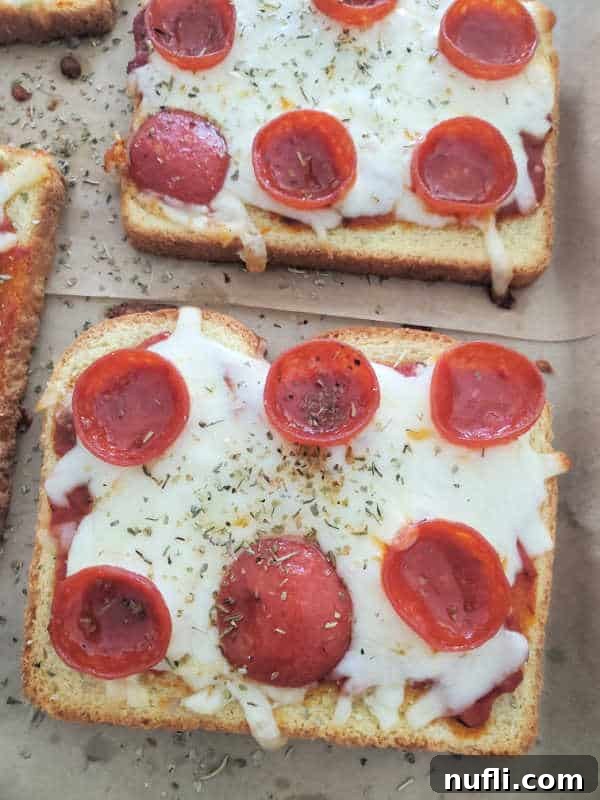pepperoni pizza toast on a parchment baking sheet