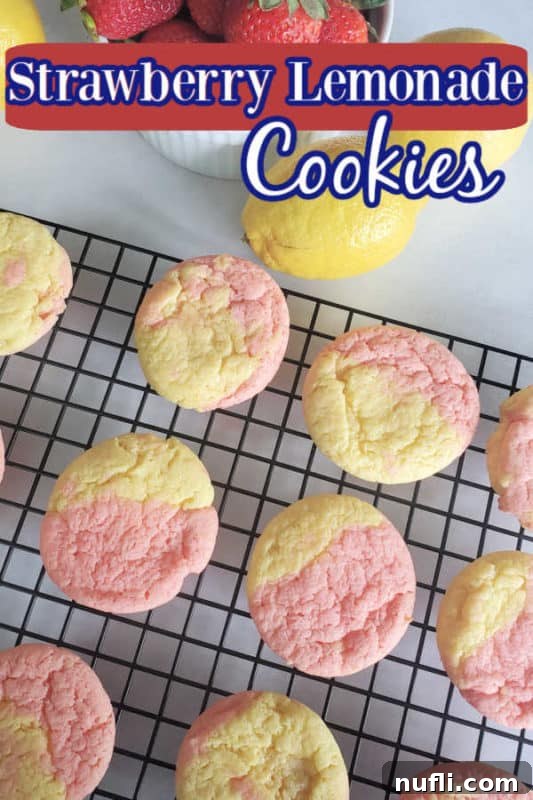 Vibrant pink and yellow Strawberry Lemonade Cookies cooling on a wire rack, ready to be enjoyed.