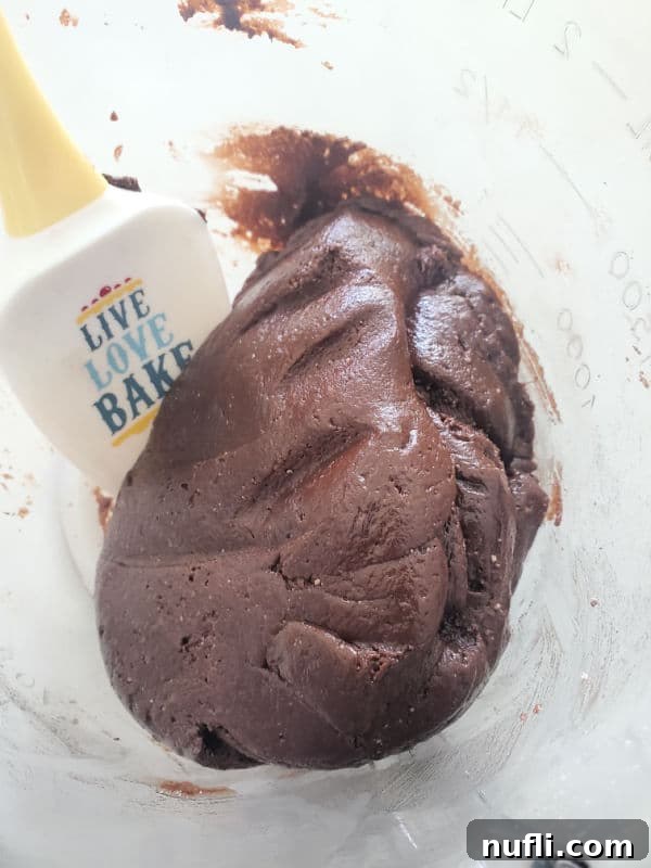 Texas sheet cake cookie dough in a bowl with a spatula
