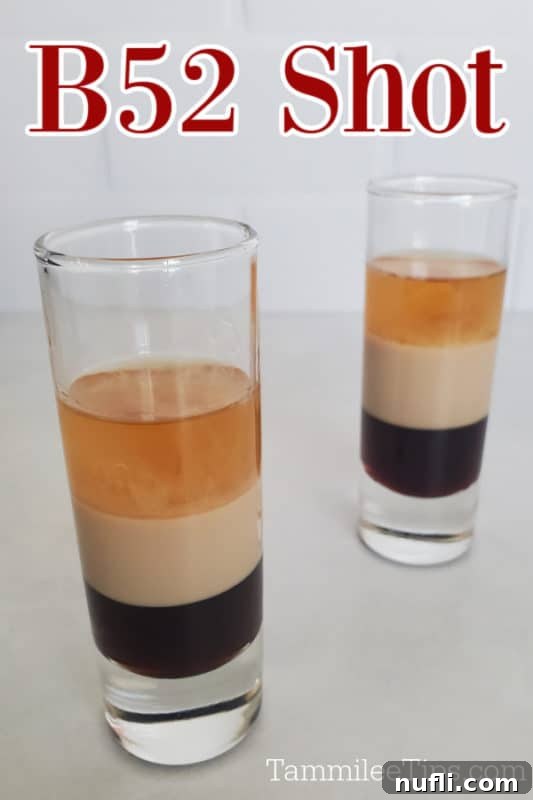 Crafting the B52 Shot A Video Guide 2 Two perfectly layered B52 shots, showcasing distinct stripes of Kahlua, Bailey's, and Grand Marnier.