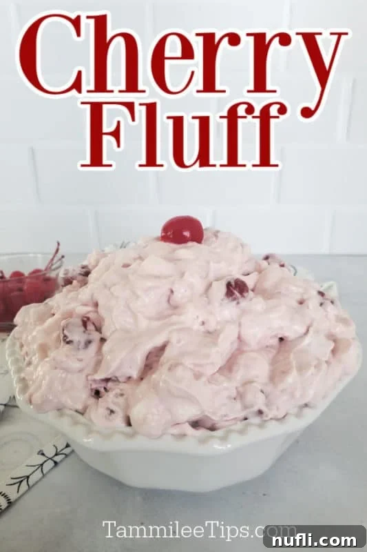 Cherry Fluff text over a white bowl filled with cherry fluff topped with a maraschino cherry