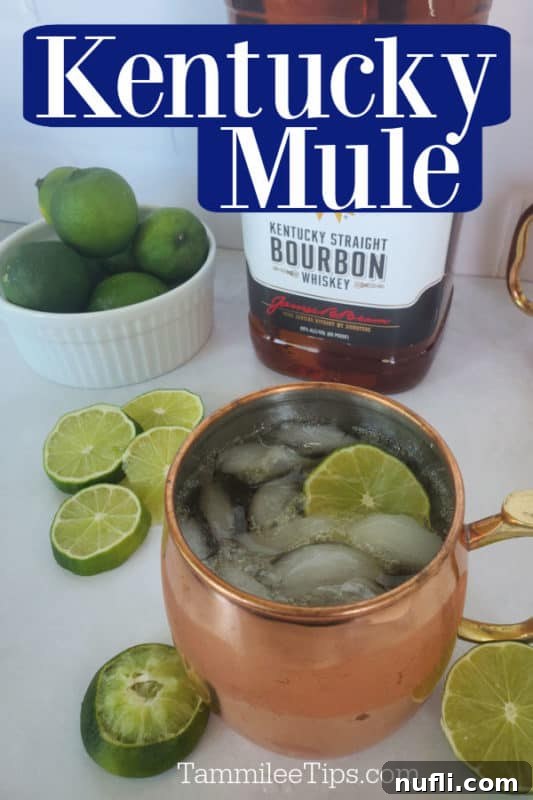 The Best Easy Kentucky Mule Recipe 2 A copper mug filled with a Kentucky Mule cocktail, garnished with fresh lime wheels. The text 'Kentucky Mule' is subtly integrated into the top of the image.
