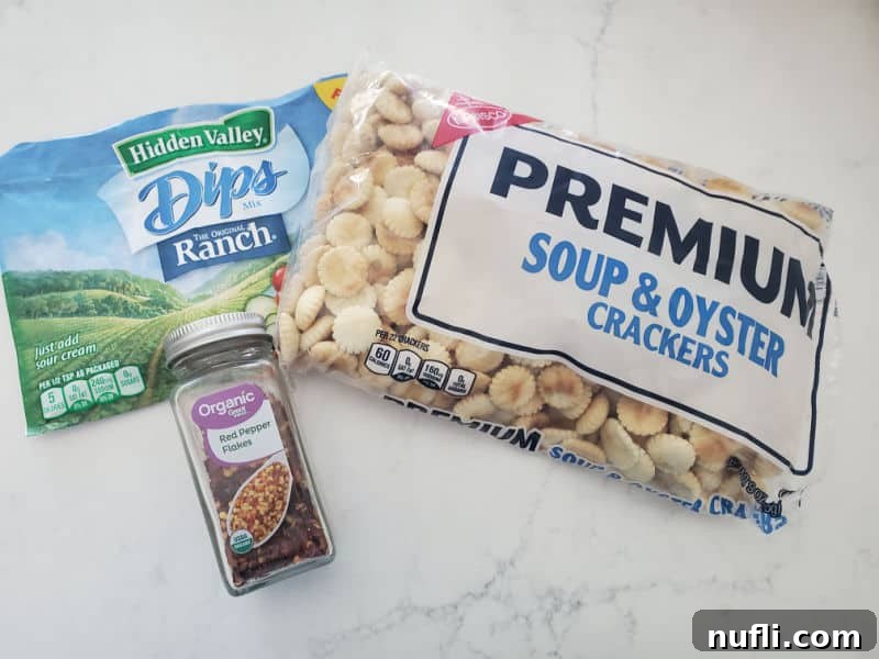Spicy Seasoned Oyster Crackers 3 Key ingredients for Spicy Oyster Crackers: Hidden Valley Ranch Mix, a bag of Oyster Crackers, and Crushed Red Pepper Flakes