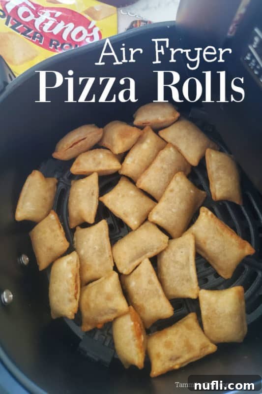 Crispy Air Fryer Pizza Rolls in the air fryer basket, perfectly golden brown and ready to eat.