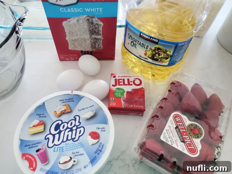 White cake mix, vegetable oil, eggs, Cool whip, Strawberry Jello, Strawberries, and a glass bowl