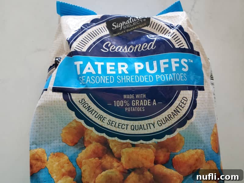 Bag of frozen tater tots on a white counter