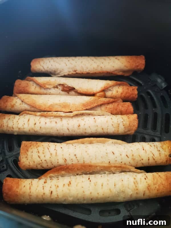 Perfectly Crispy Frozen Taquitos in the Air Fryer 4 Air fried taquitos in the air fryer basket